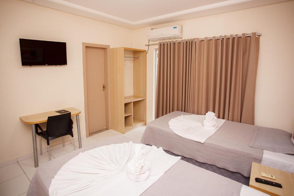 Postel nebo postele na pokoji v ubytování Starbello Hotel