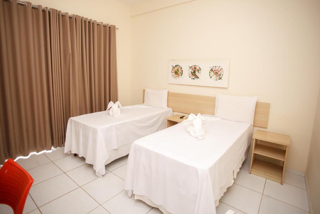 Postel nebo postele na pokoji v ubytování Starbello Hotel