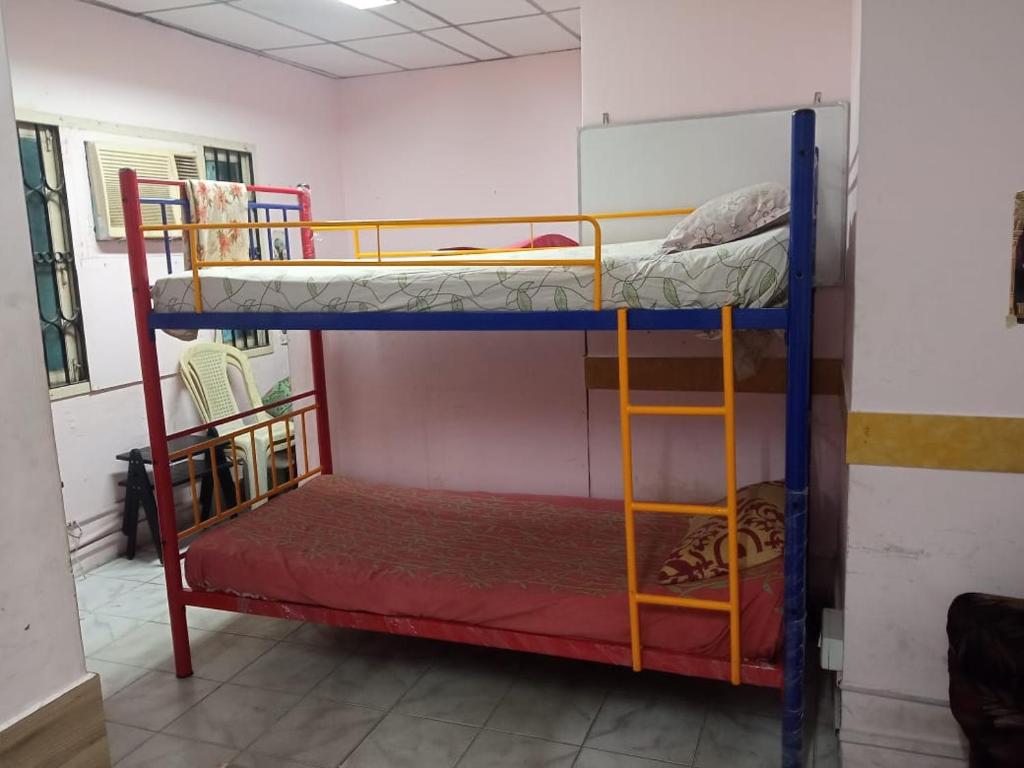 Postel nebo postele na pokoji v ubytování WISHTREE CORPORATE MENS DORMITORY FOR TECHIES AND Trainees
