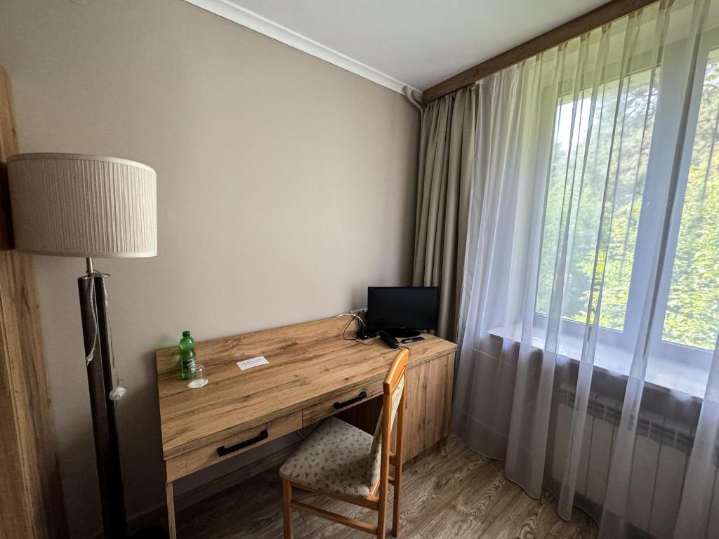 Telewizja i/lub zestaw kina domowego w obiekcie Hotel Echo