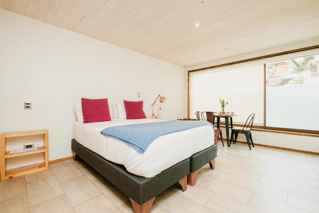 Postel nebo postele na pokoji v ubytování Hotel Mar & Vino