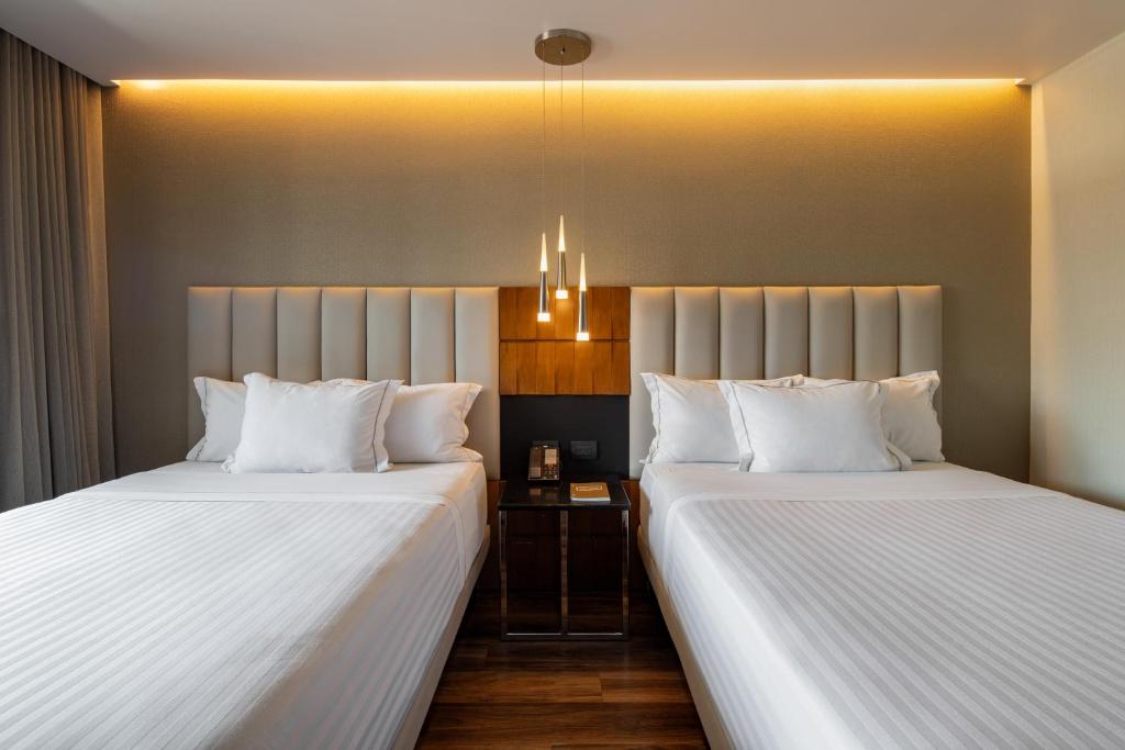 Postel nebo postele na pokoji v ubytování Hotel Real del Rio