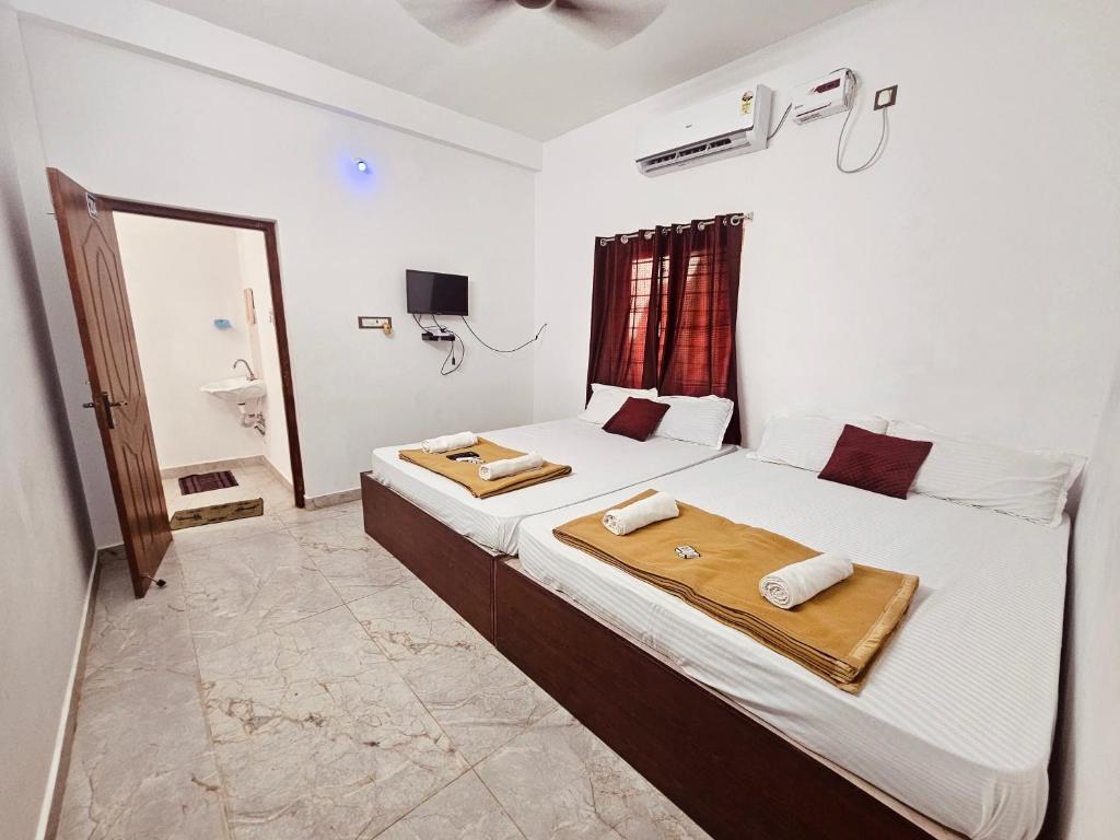 Postel nebo postele na pokoji v ubytování De villa Breeze Beach Inn