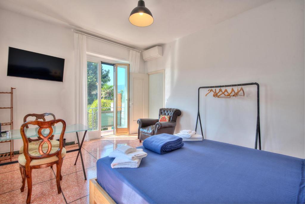 Postel nebo postele na pokoji v ubytování Nel Verde Family Suite