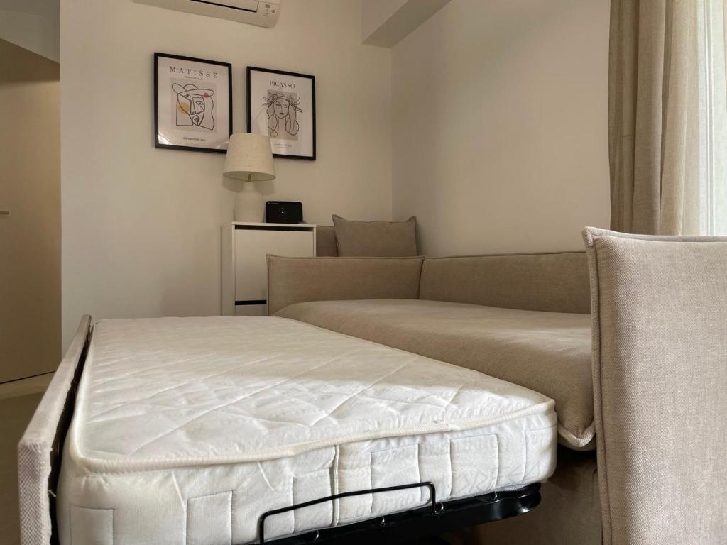 Postel nebo postele na pokoji v ubytování Morpheus boutique apartment