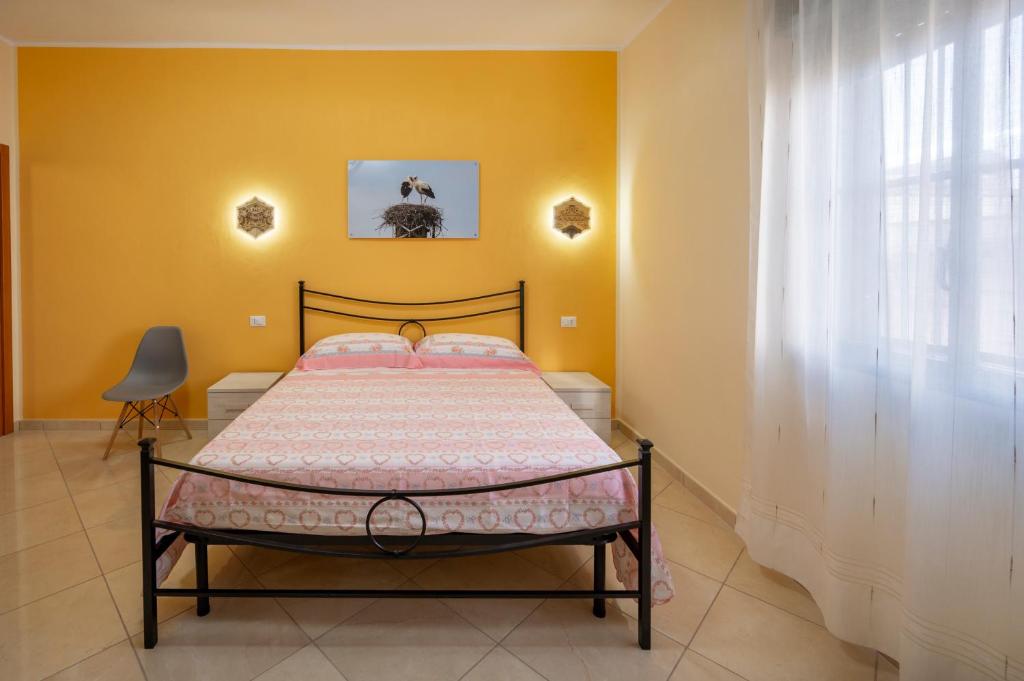 Postel nebo postele na pokoji v ubytování Il cappello sulle 23! Camere in affitto breve