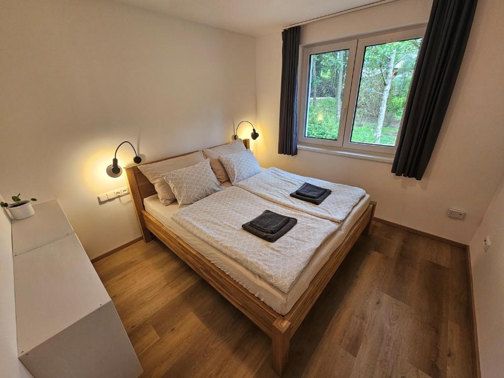 Postel nebo postele na pokoji v ubytování Apartmán v tichu