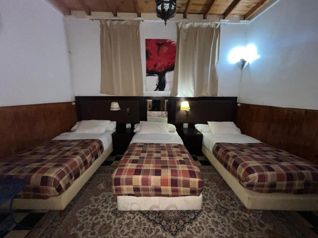 Postelja oz. postelje v sobi nastanitve Riad Le Lieu