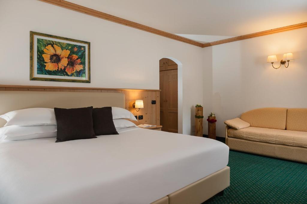 Postel nebo postele na pokoji v ubytování Hotel La Maison Wellness & Spa