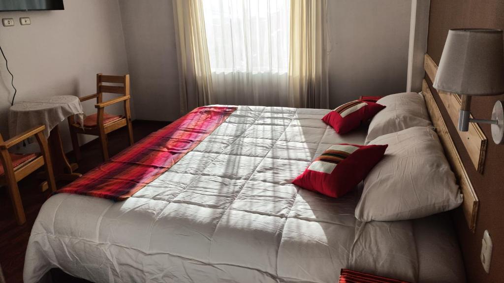 Postel nebo postele na pokoji v ubytování kuntur inn hotel