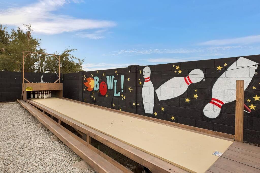 a wall with a mural of animals on it at Lux Fun Zone Home - Sleeps 16 in Mesa