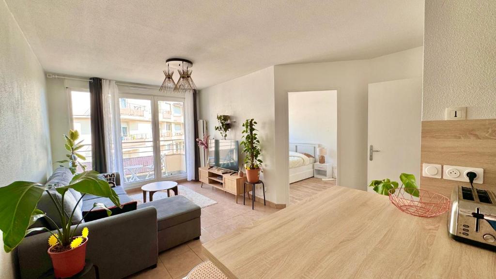 Η κουζίνα ή μικρή κουζίνα στο Logement lumineux 10min Disney