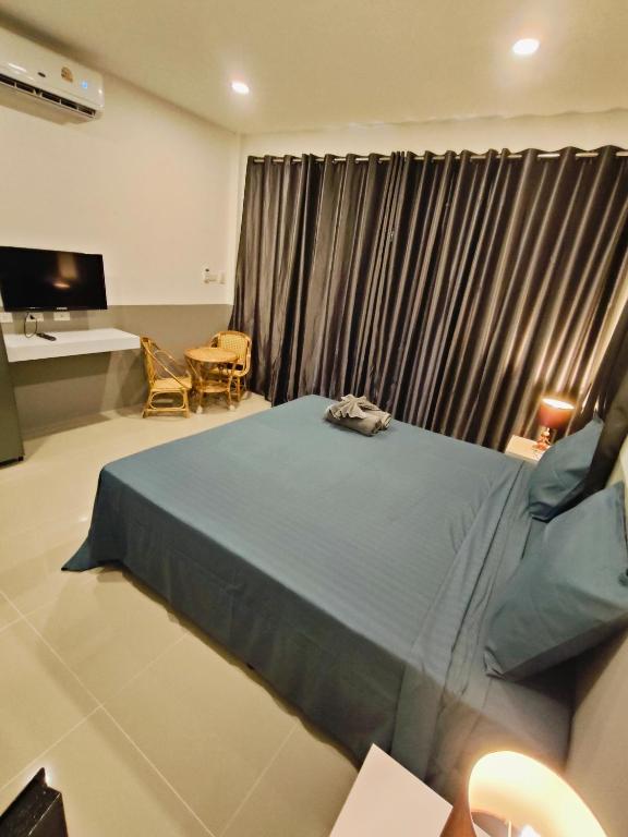 Postel nebo postele na pokoji v ubytování Ban Elephant Blanc Bungalow