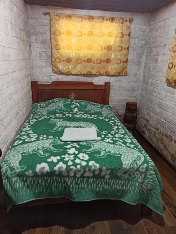 Postel nebo postele na pokoji v ubytování Hostal La Rosita