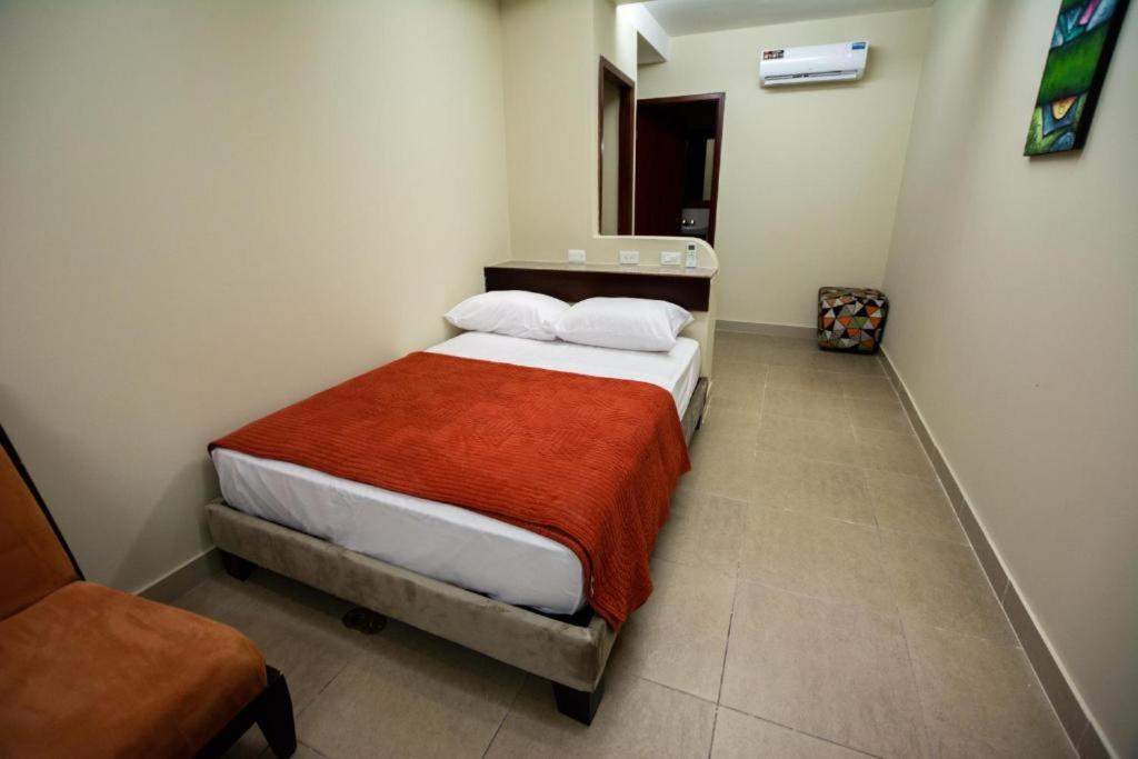 Postel nebo postele na pokoji v ubytování HM International Hotel