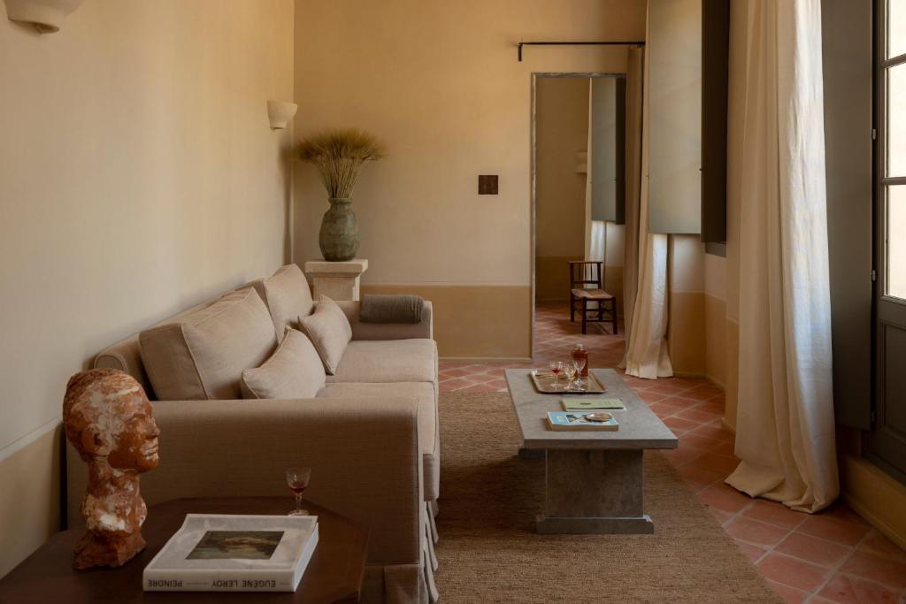 a living room with a couch and a table at Hôtel du Couvent, a Luxury Collection Hotel, Nice in Nice