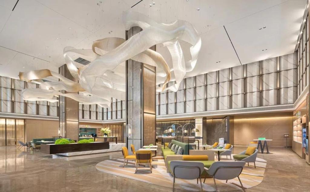 Posezení v ubytování Home2 by Hilton Chongqing Wushan