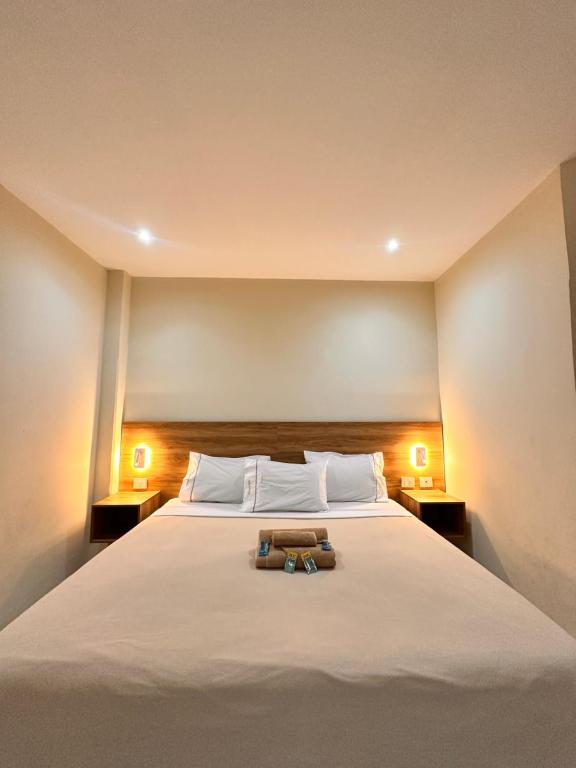 Postel nebo postele na pokoji v ubytování Hotel Centro Apatzingán