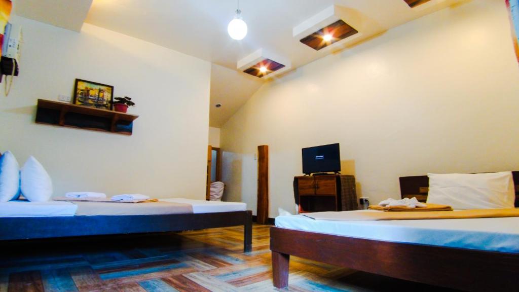 Postel nebo postele na pokoji v ubytování Southdrive Beach Resort