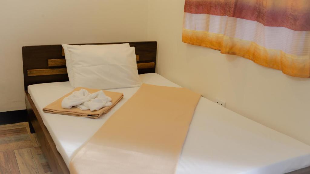 Postel nebo postele na pokoji v ubytování Southdrive Beach Resort