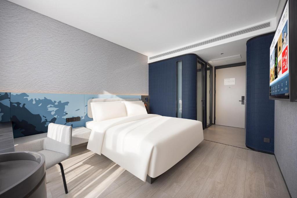 Postel nebo postele na pokoji v ubytování Atour Light Hotel Shenyang Yuhong Plaza Metro Station