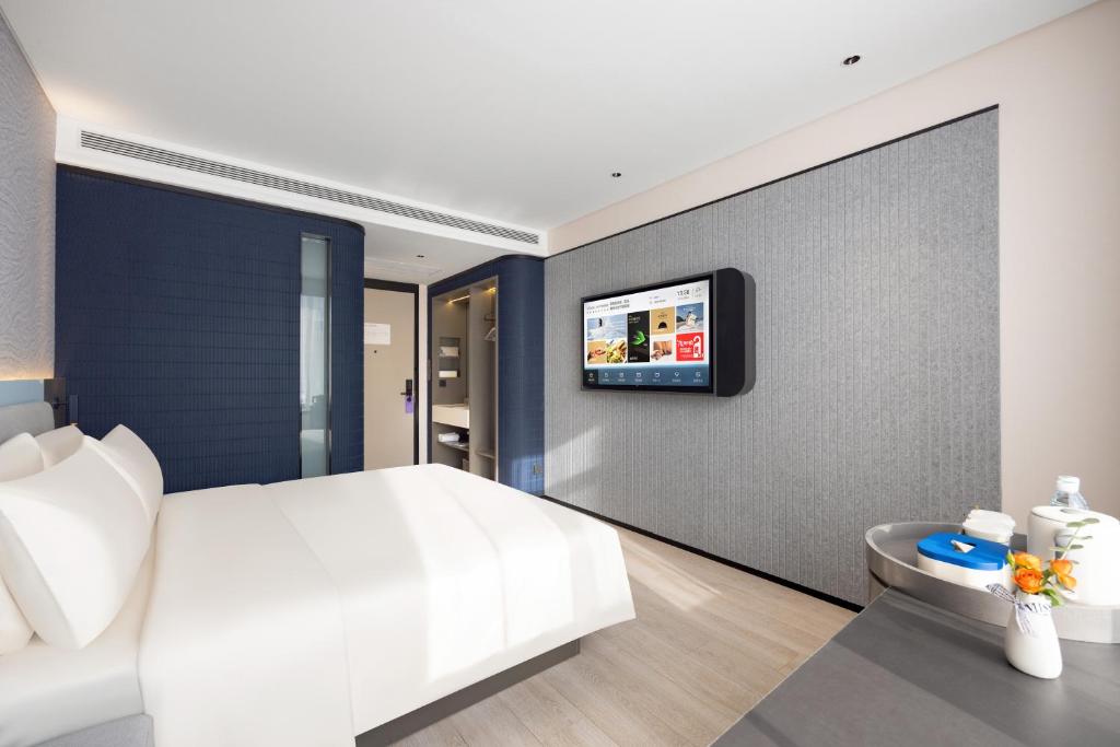 TV a/nebo společenská místnost v ubytování Atour Light Hotel Shenyang Yuhong Plaza Metro Station