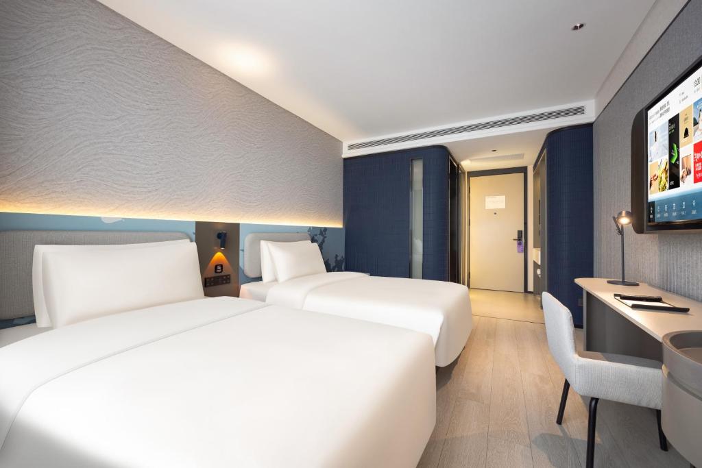 Postel nebo postele na pokoji v ubytování Atour Light Hotel Shenyang Yuhong Plaza Metro Station