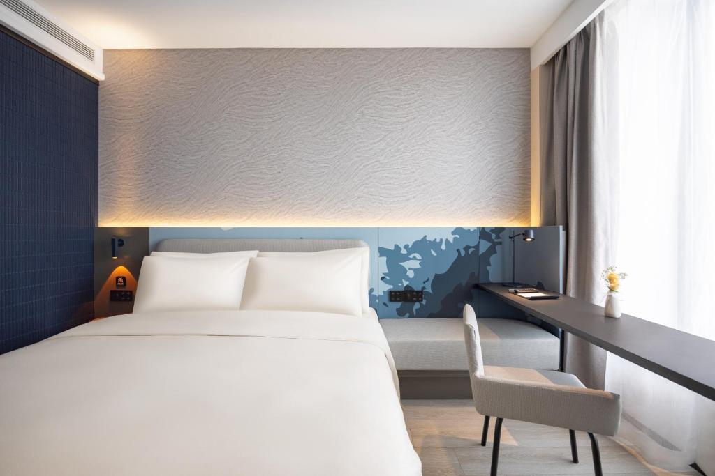 Postel nebo postele na pokoji v ubytování Atour Light Hotel Shenyang Yuhong Plaza Metro Station