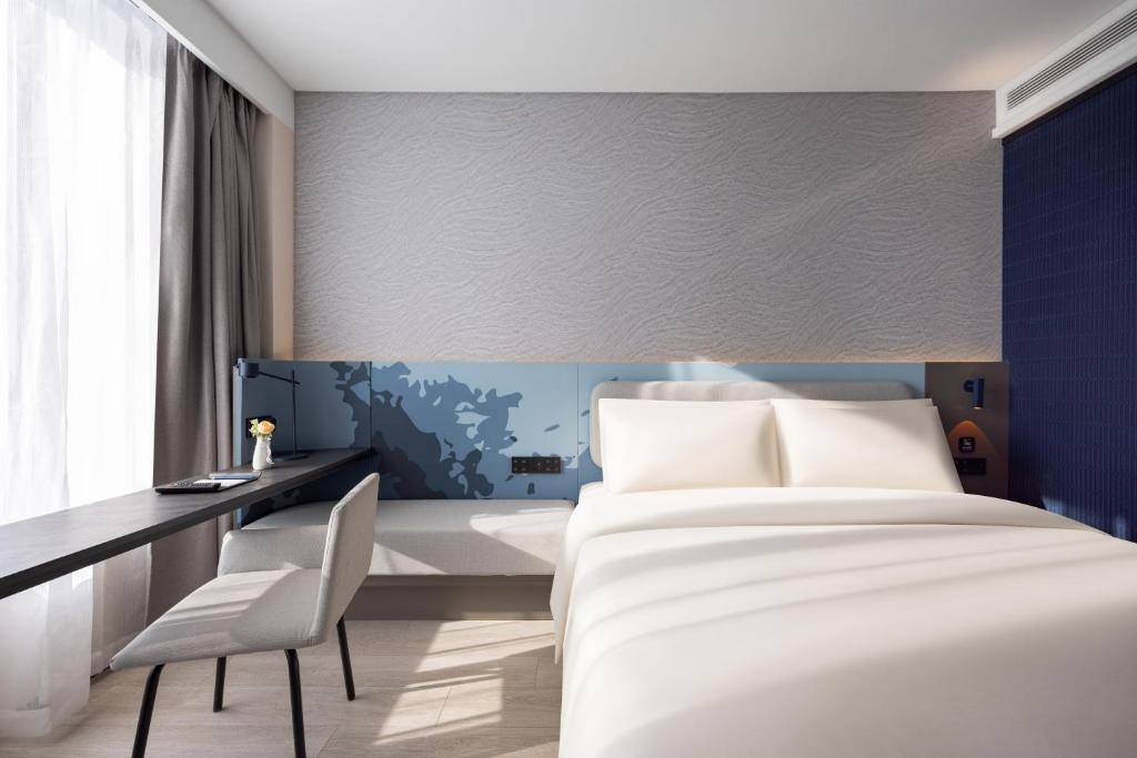 Postel nebo postele na pokoji v ubytování Atour Light Hotel Shenyang Yuhong Plaza Metro Station