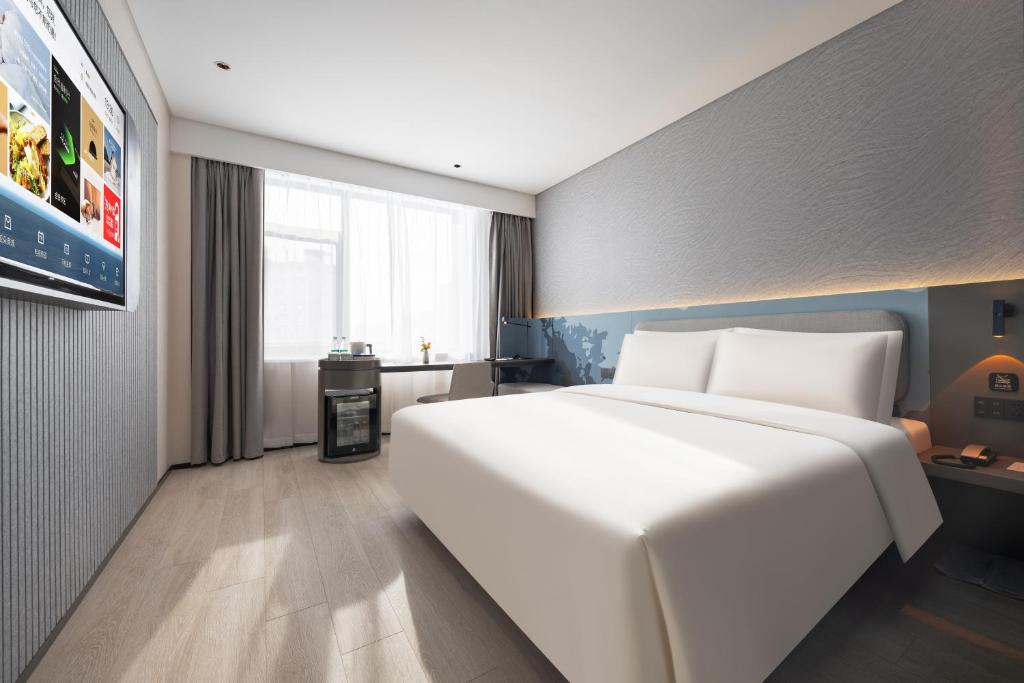 Postel nebo postele na pokoji v ubytování Atour Light Hotel Shenyang Yuhong Plaza Metro Station