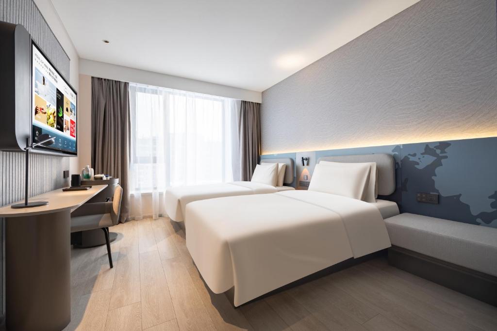 Postel nebo postele na pokoji v ubytování Atour Light Hotel Shenyang Yuhong Plaza Metro Station