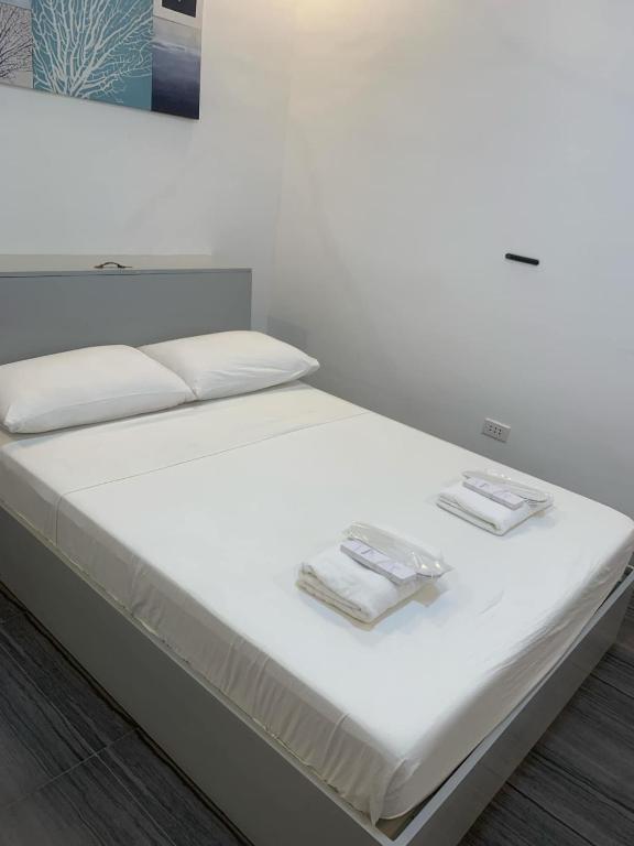 Postel nebo postele na pokoji v ubytování MAMORI HOTEL