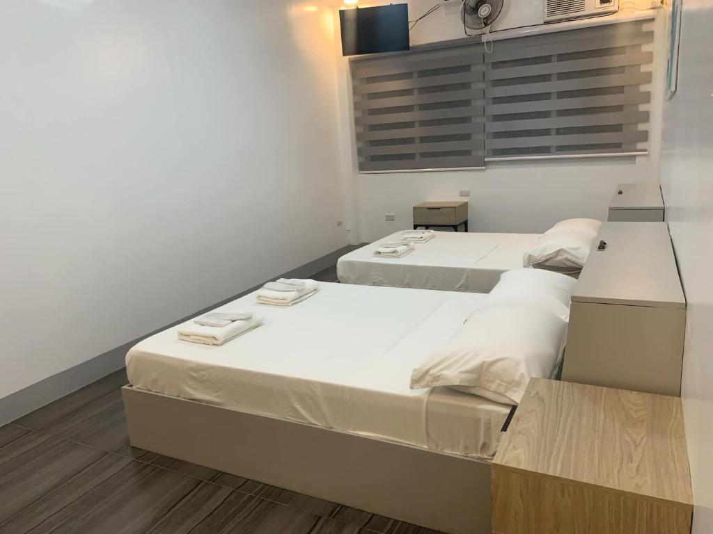 Postel nebo postele na pokoji v ubytování MAMORI HOTEL