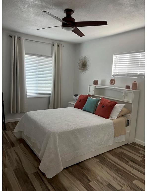 a bedroom with a bed and a ceiling fan at West Mitchell in Phoenix