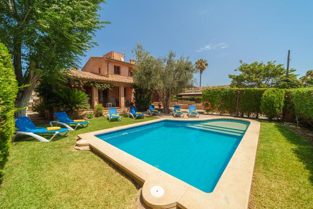 a swimming pool in the yard of a house at E415 Can Xisco by Mallorca Villa Selection in Port de Pollensa