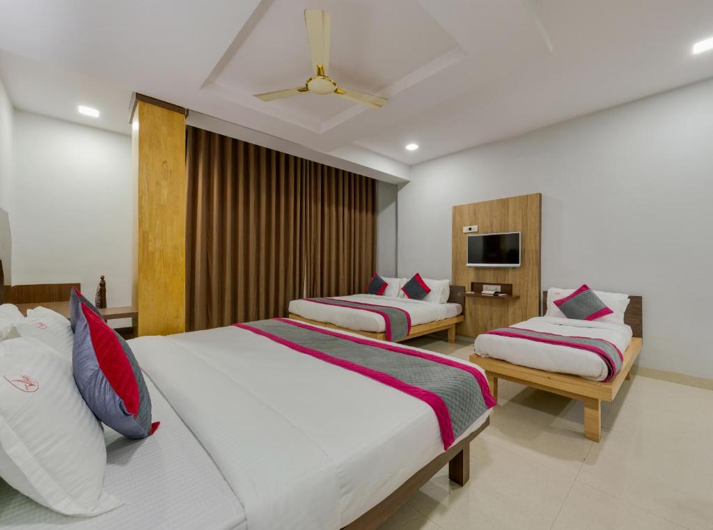Postel nebo postele na pokoji v ubytování Hotel Vihar Deluxe