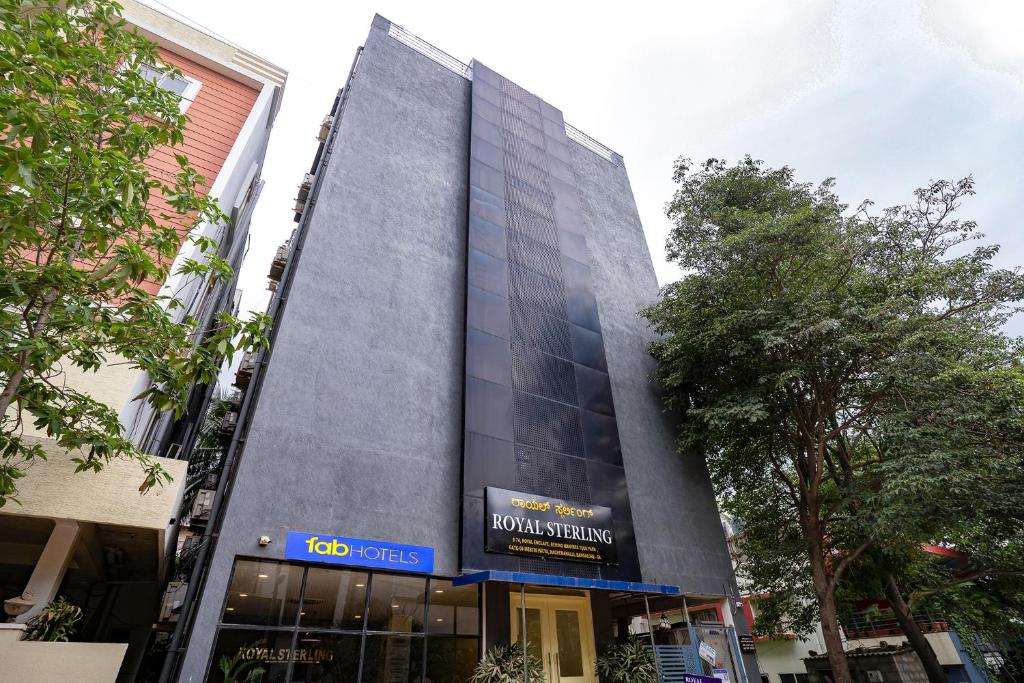 a building with a sign on the side of it at FabExpress Royal Sterling - Nr Manyata Tech Park in Bengaluru