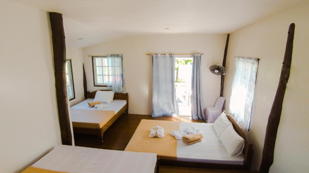 Postel nebo postele na pokoji v ubytování Southdrive Beach Resort
