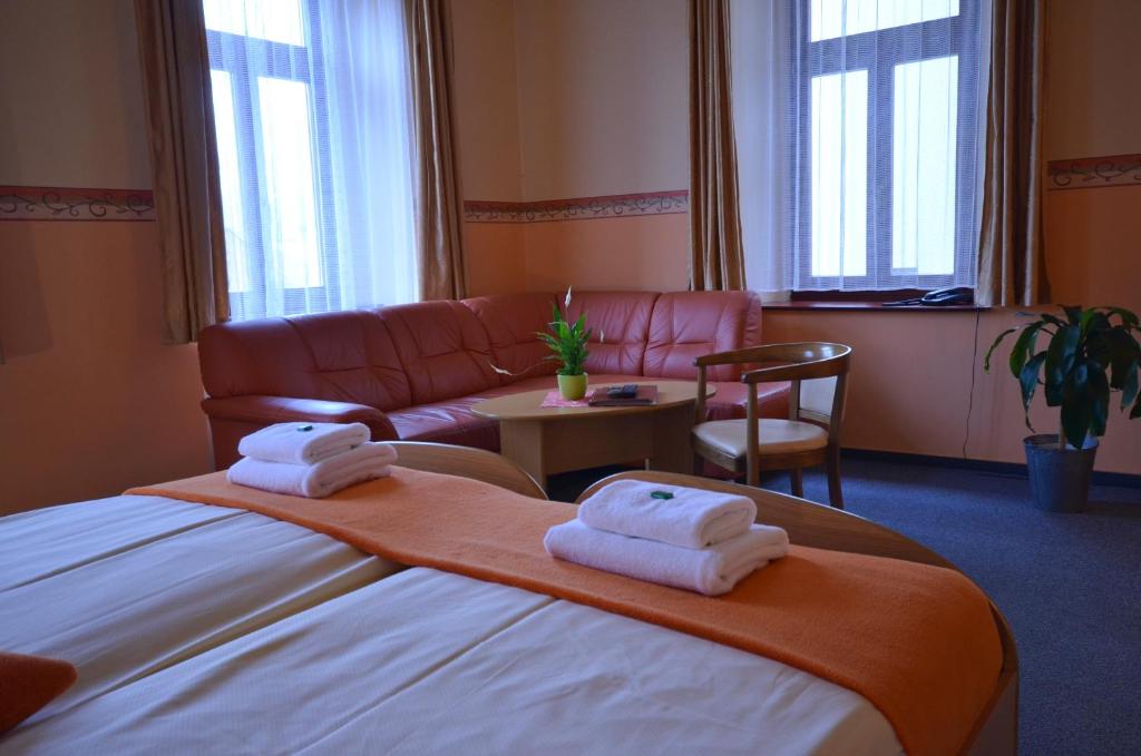 Postel nebo postele na pokoji v ubytování Hotel U Kozicky
