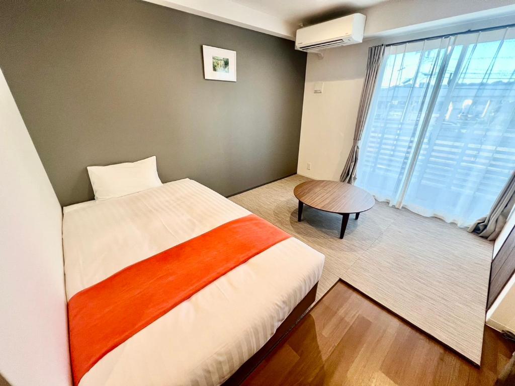 Postel nebo postele na pokoji v ubytování Apartment Hotel Ecott