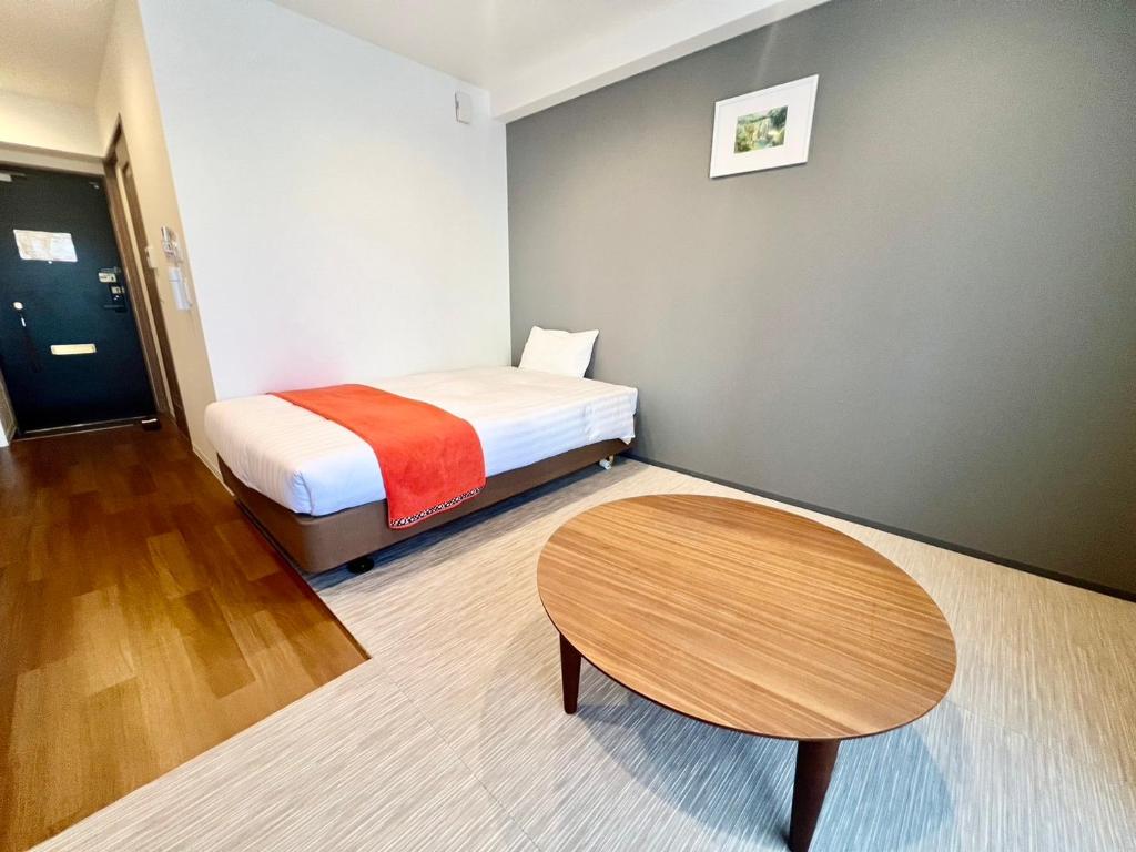 Postel nebo postele na pokoji v ubytování Apartment Hotel Ecott
