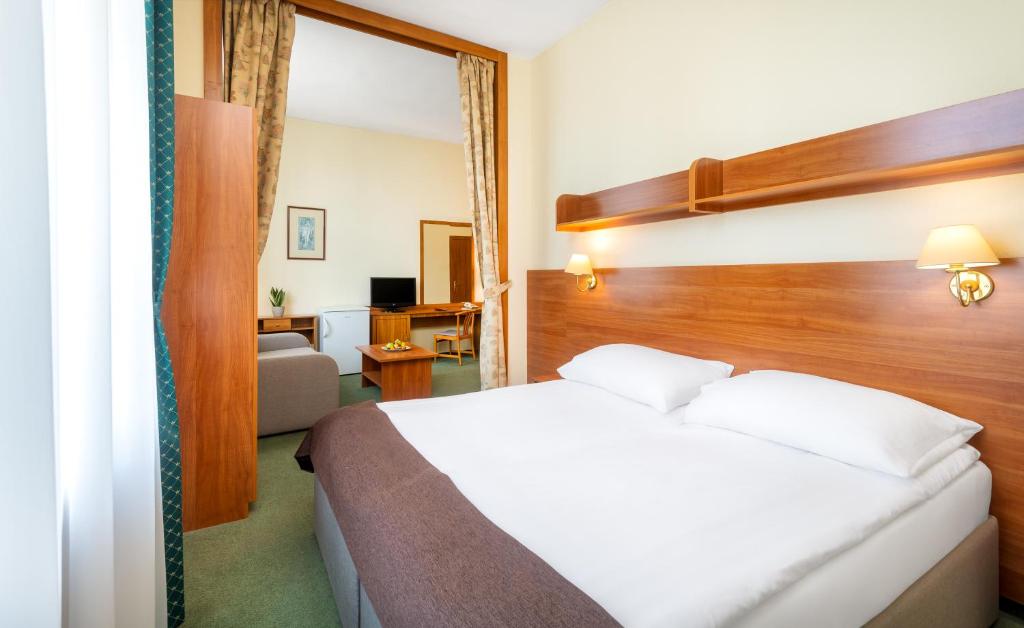 Posteľ alebo postele v izbe v ubytovaní Hotel Millennium