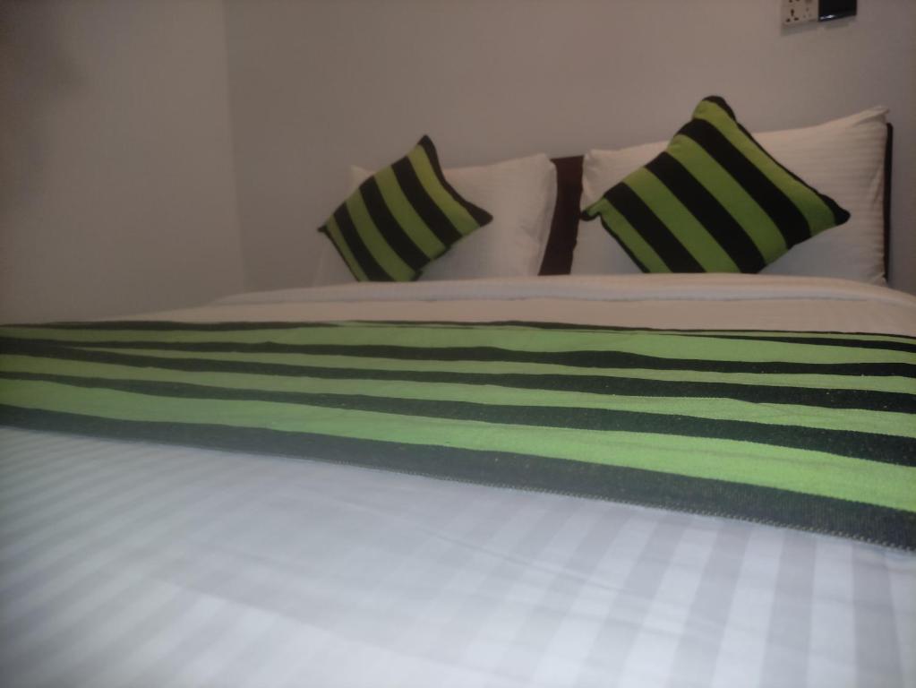 Postel nebo postele na pokoji v ubytování MUM Jungle Inn