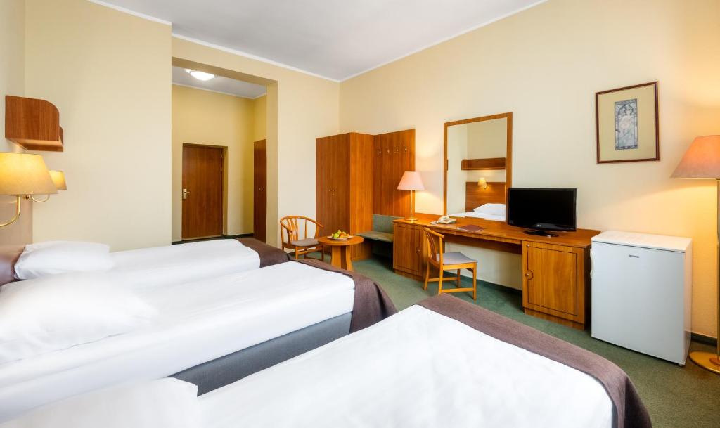 Posteľ alebo postele v izbe v ubytovaní Hotel Millennium