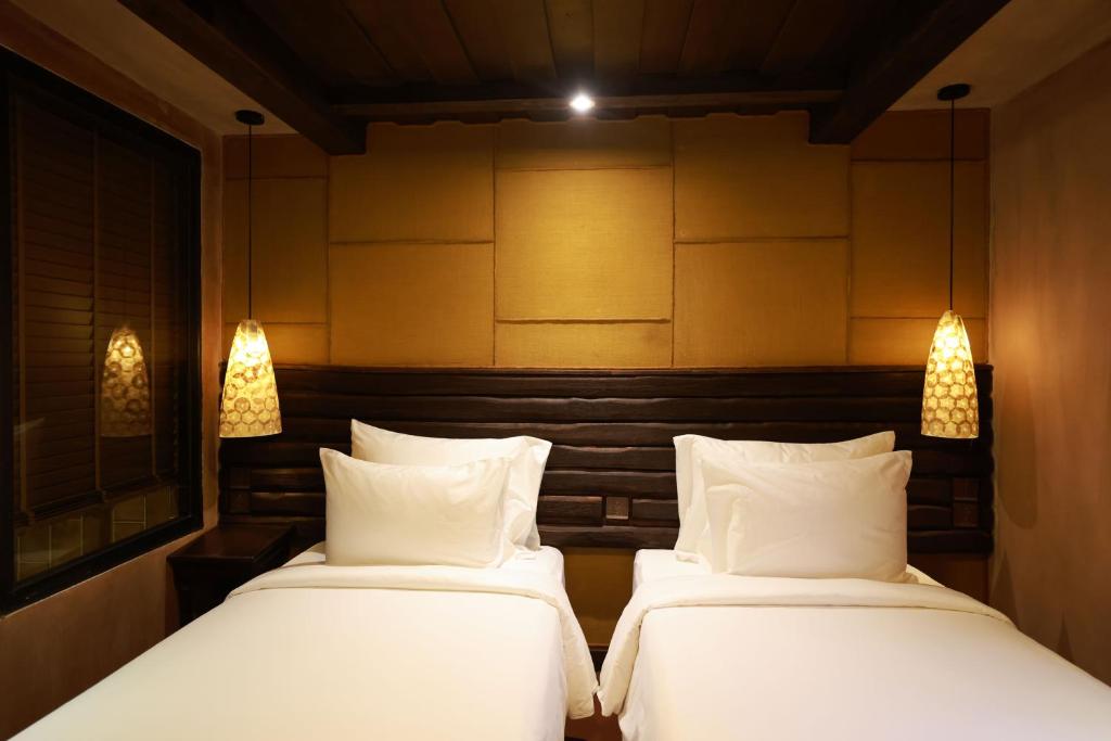 Postel nebo postele na pokoji v ubytování Kecho Legacy Hotel Hanoi & Spa