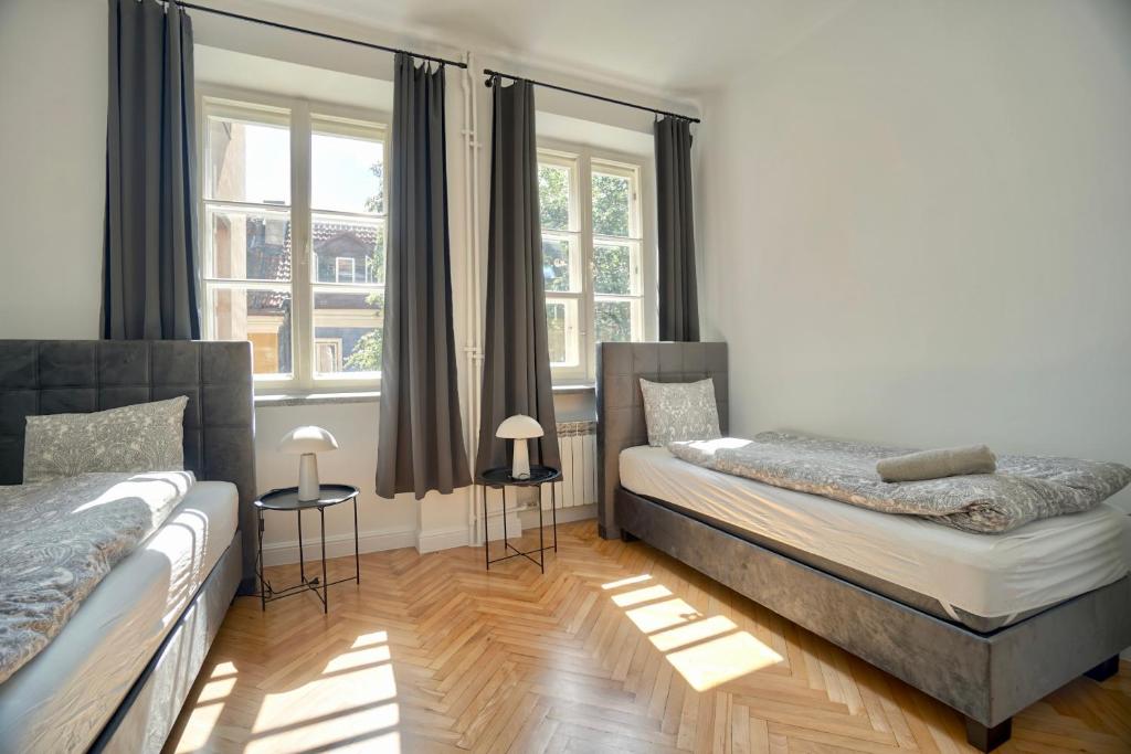 Posteľ alebo postele v izbe v ubytovaní Warsaw Premium Apartments Old Town