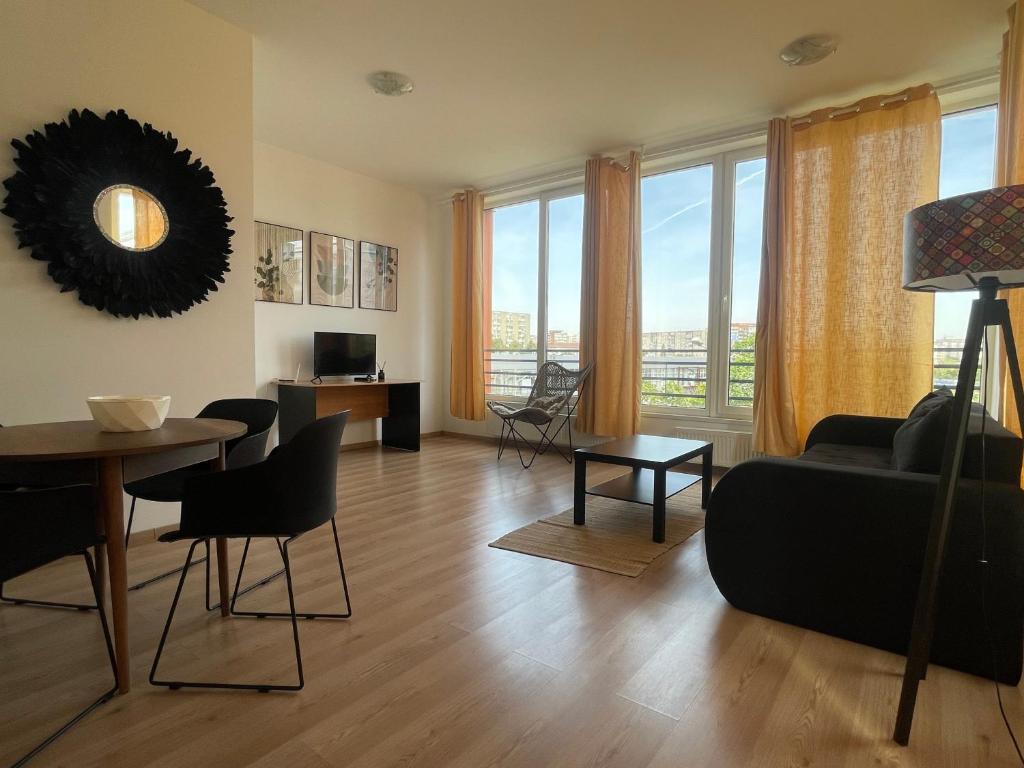 a living room with a couch and a table at NEW Central nr2 Self Checkin OldCity Center Paid Parking with Lift in Timişoara