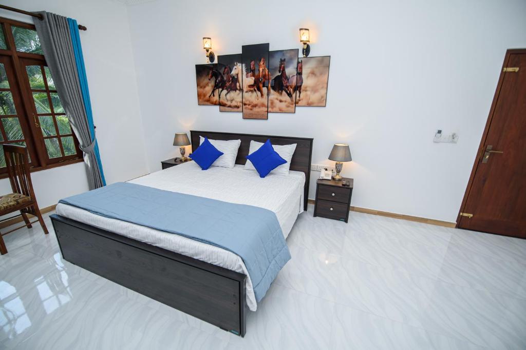 Postel nebo postele na pokoji v ubytování Royal Blu