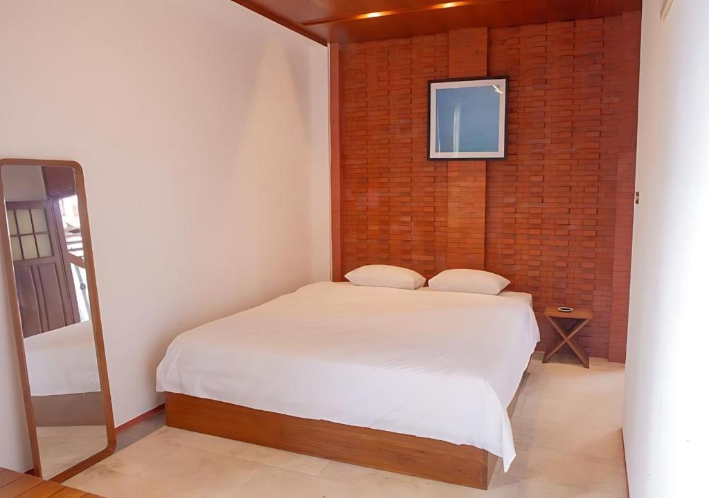Postel nebo postele na pokoji v ubytování Nyaman Hostel