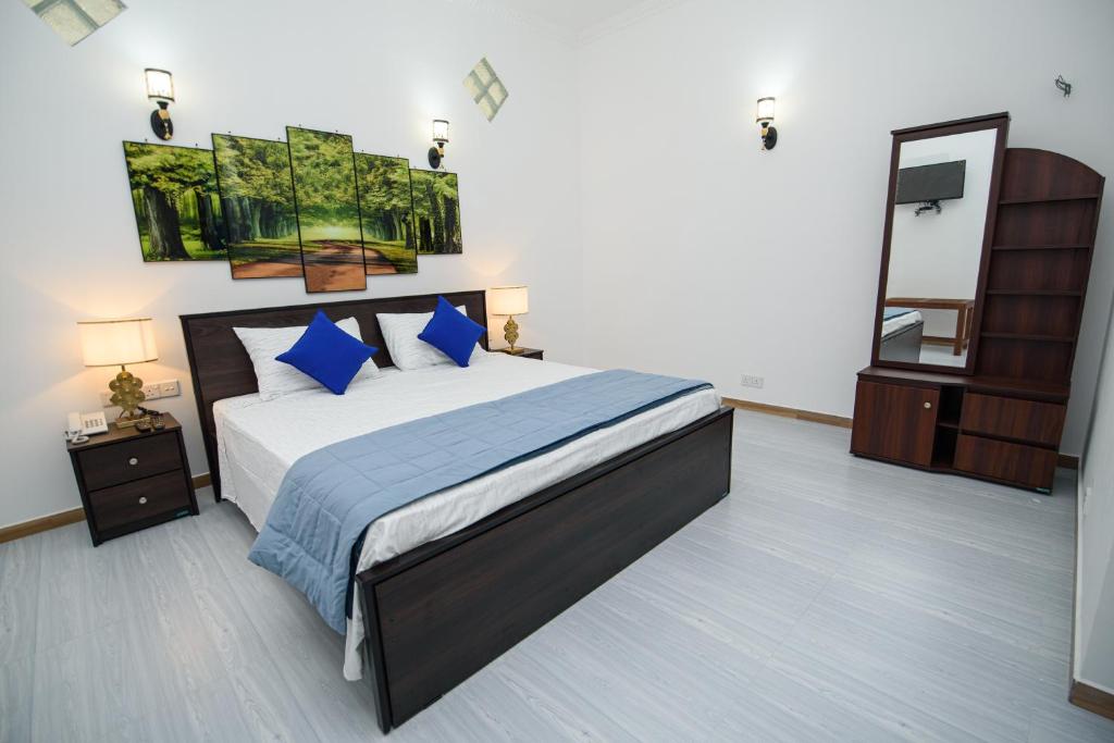 Postel nebo postele na pokoji v ubytování Royal Blu